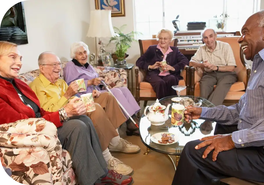 A group of people sitting around in chairs.