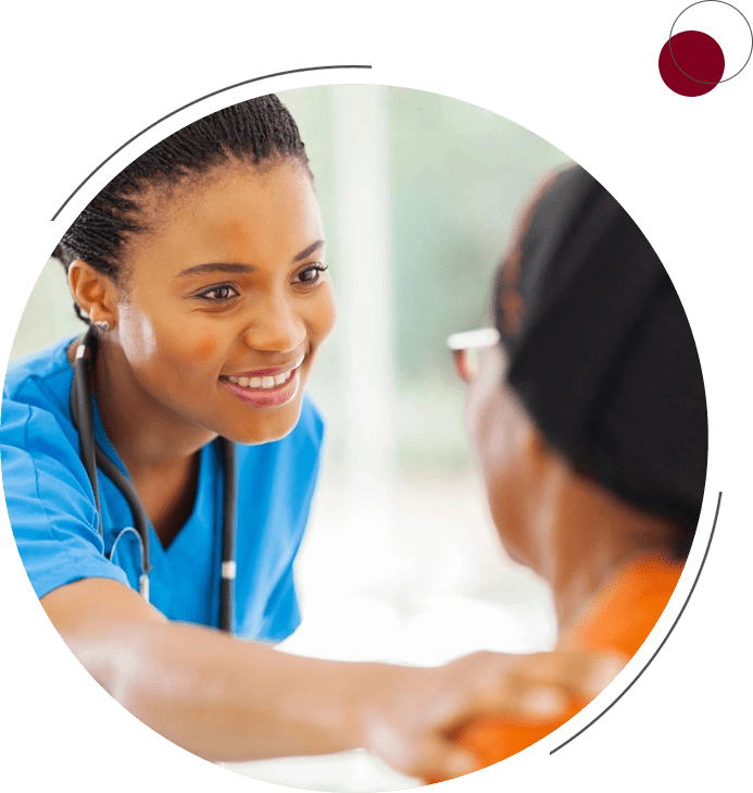 A woman in blue scrubs talking to someone.